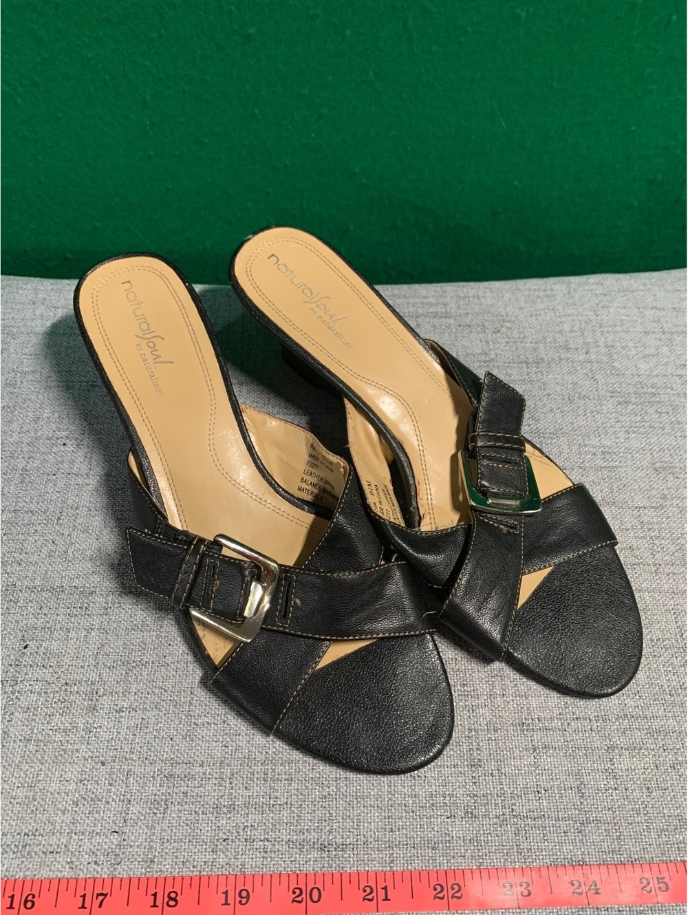 Black heeled slide sandals with buckle detail